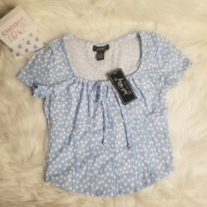 This cute summer blue shirt with white flowers  it has a corset form